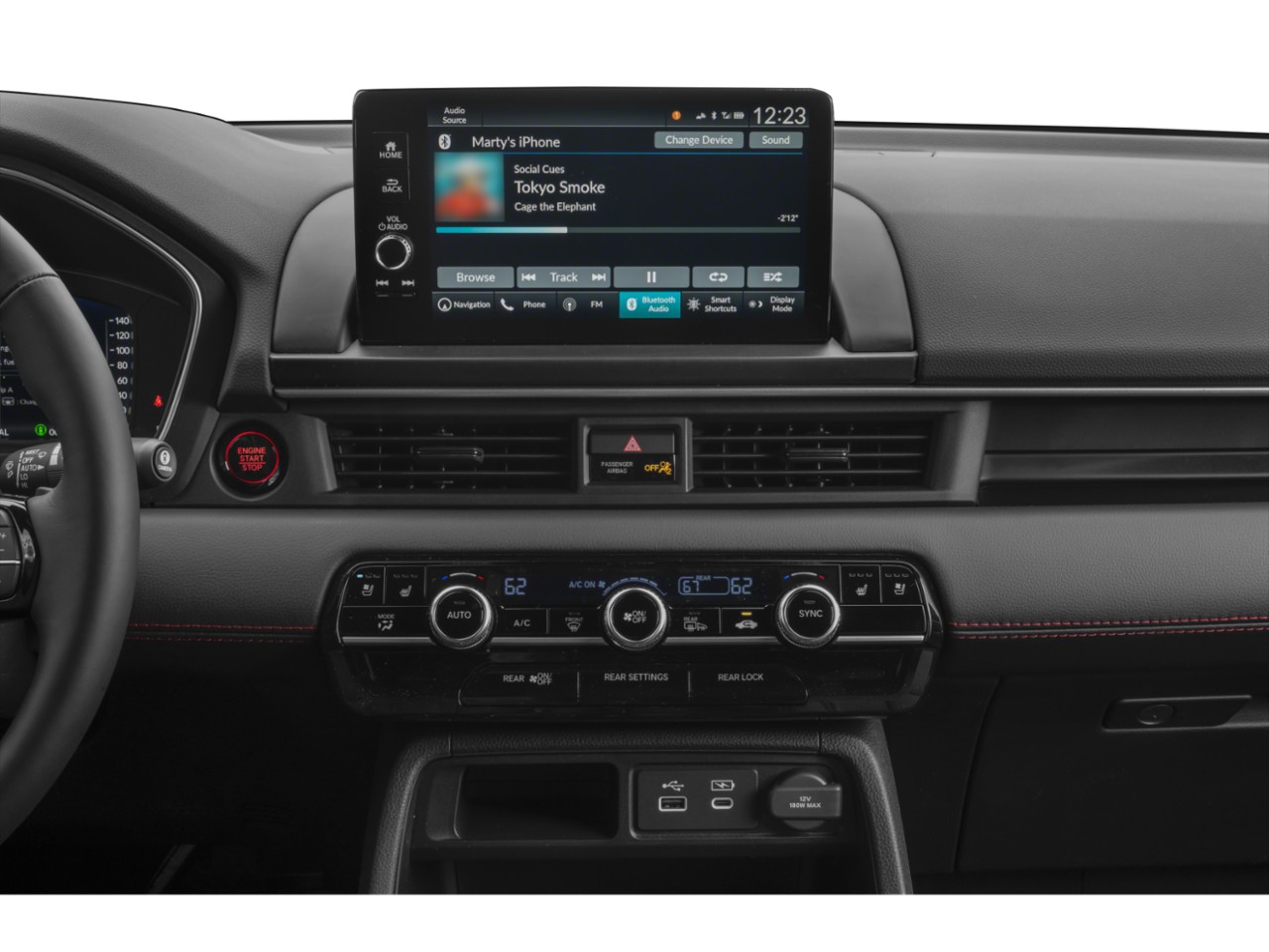 Infotainment touchscreen and digital climate control panel with USB ports and engine start button