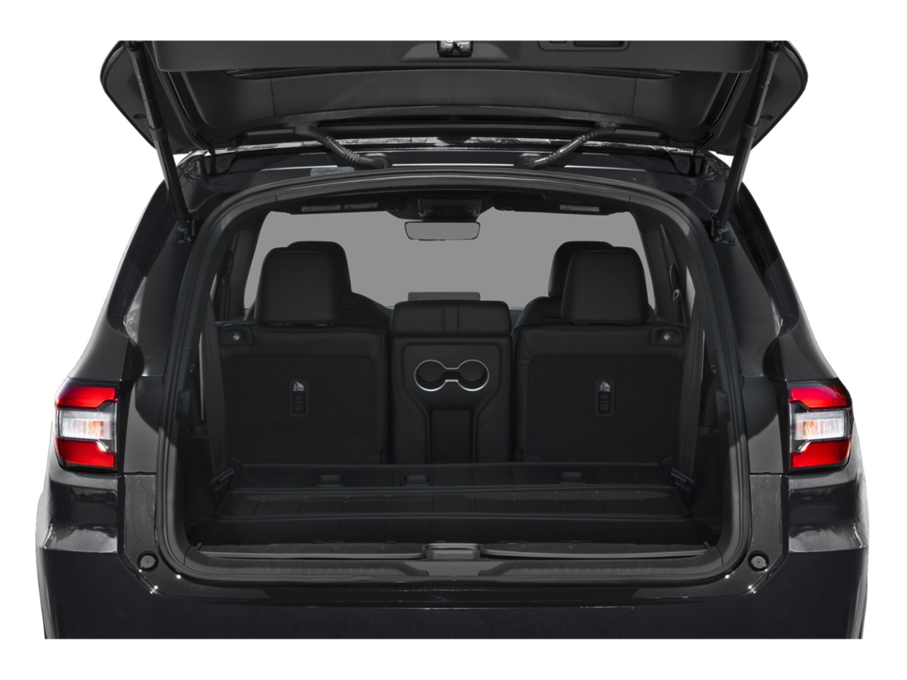 Spacious rear cargo area with rear seats and integrated cup holders