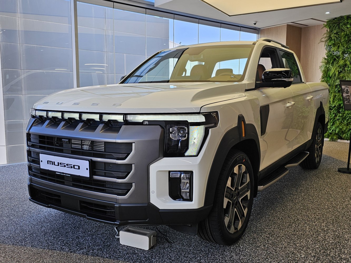 Front view of pickup with bold grille and LED headlights