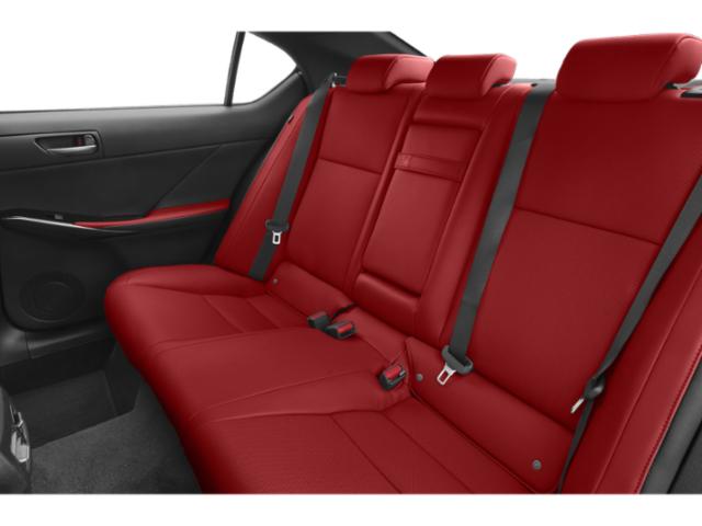 Red leather rear seats with seatbelts and door panel.