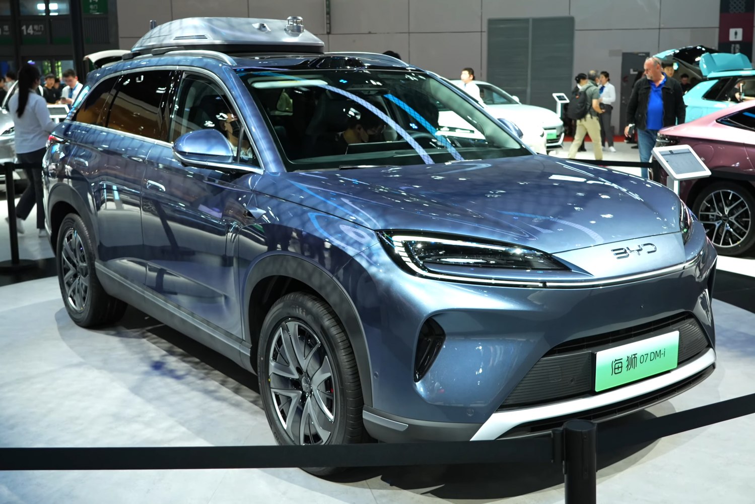 Front and side view of SUV with sleek headlights and aerodynamic design