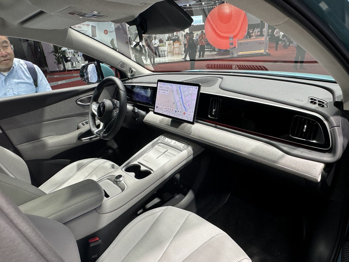 Modern car interior with central touchscreen and streamlined dashboard