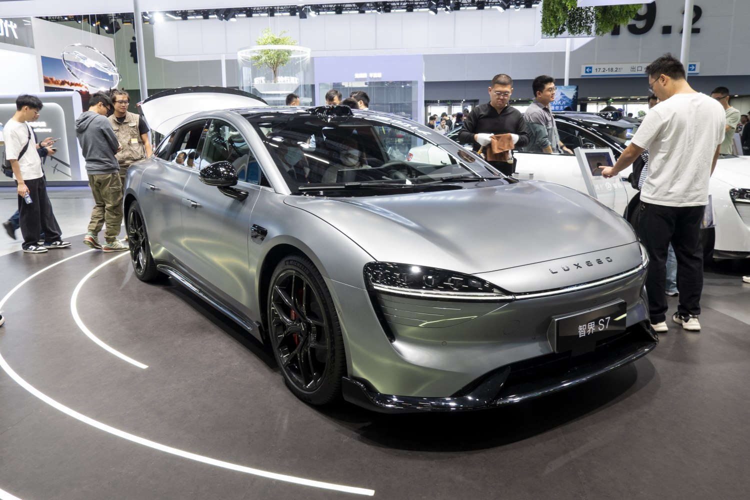 Electric sedan with sleek aerodynamic front and black alloy wheels
