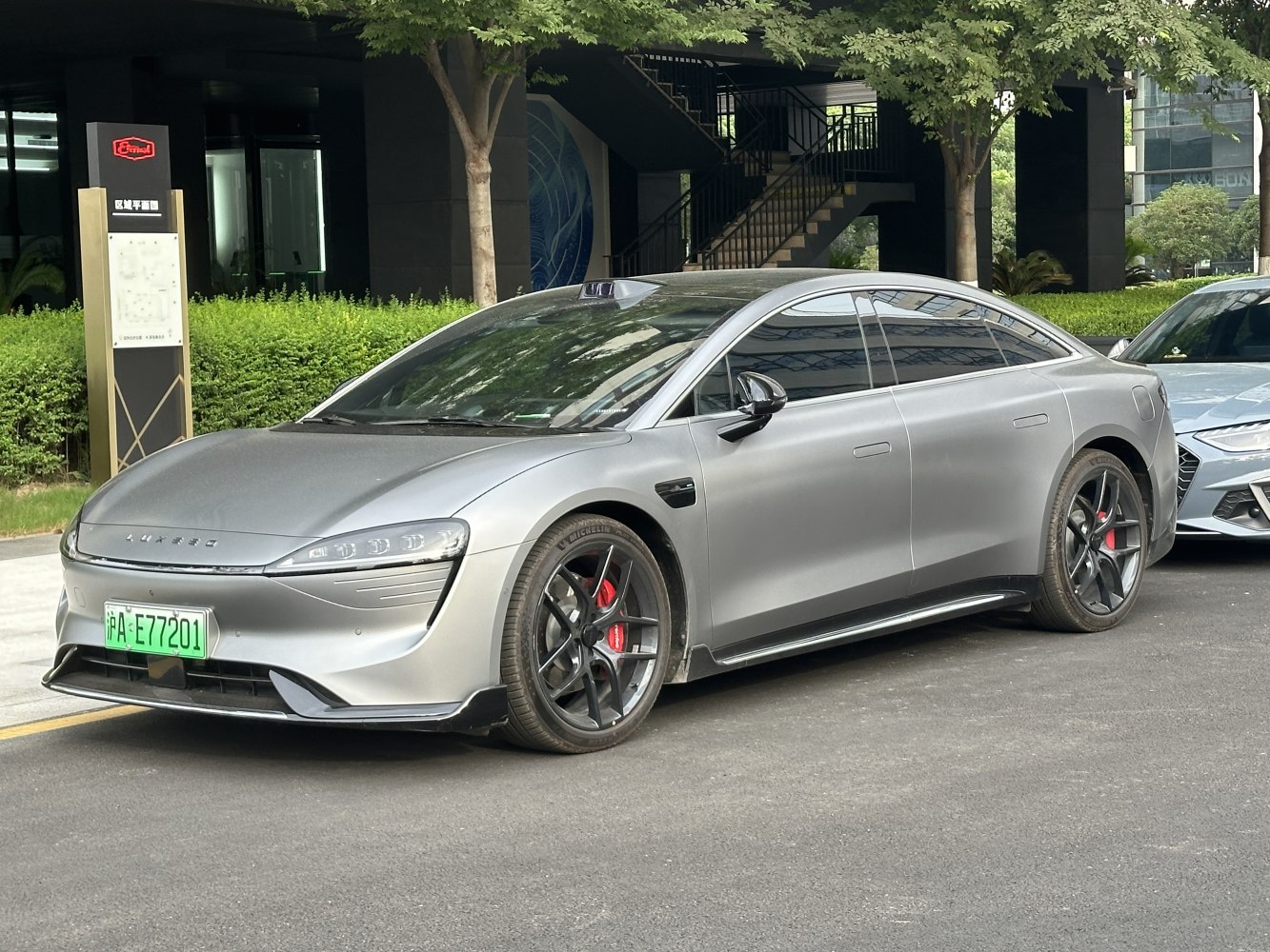 Sleek aerodynamic electric sedan with sporty alloy wheels and modern design