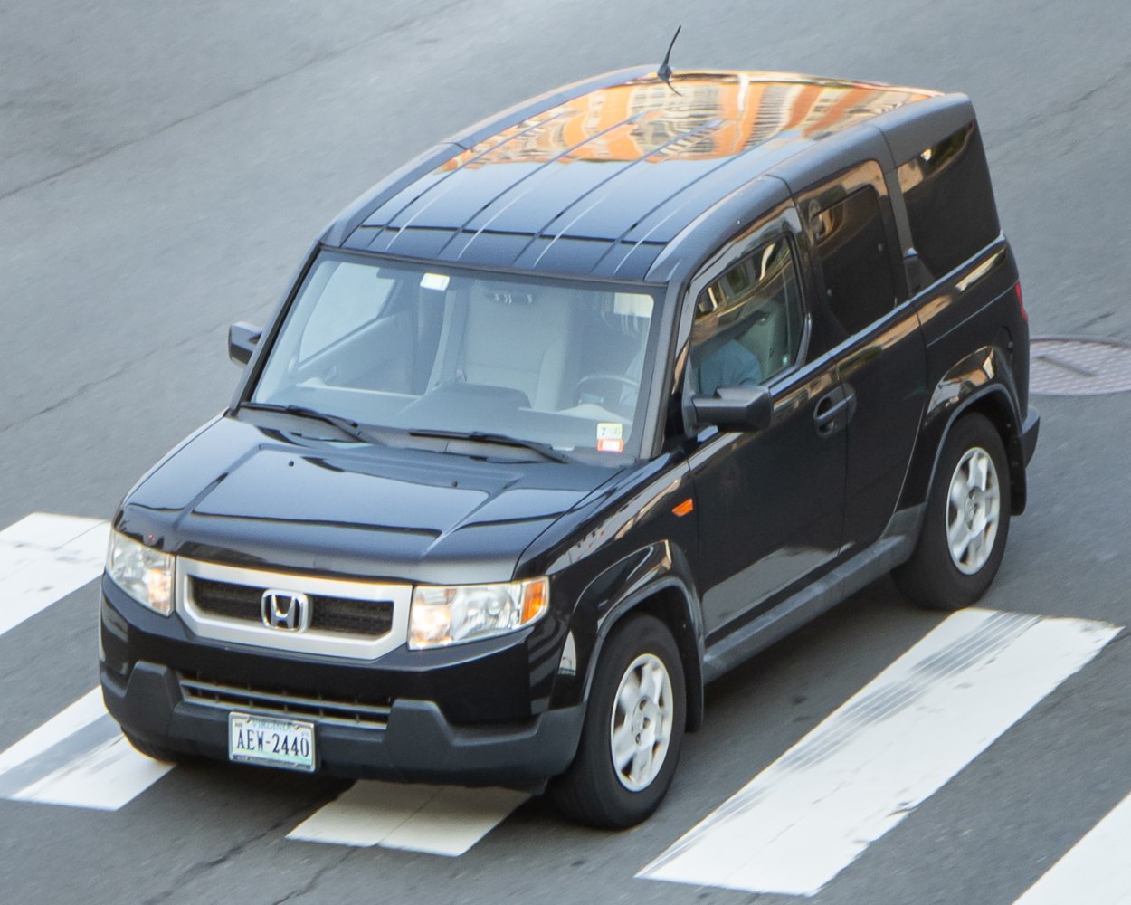 Boxy SUV front and side view with distinctive grille