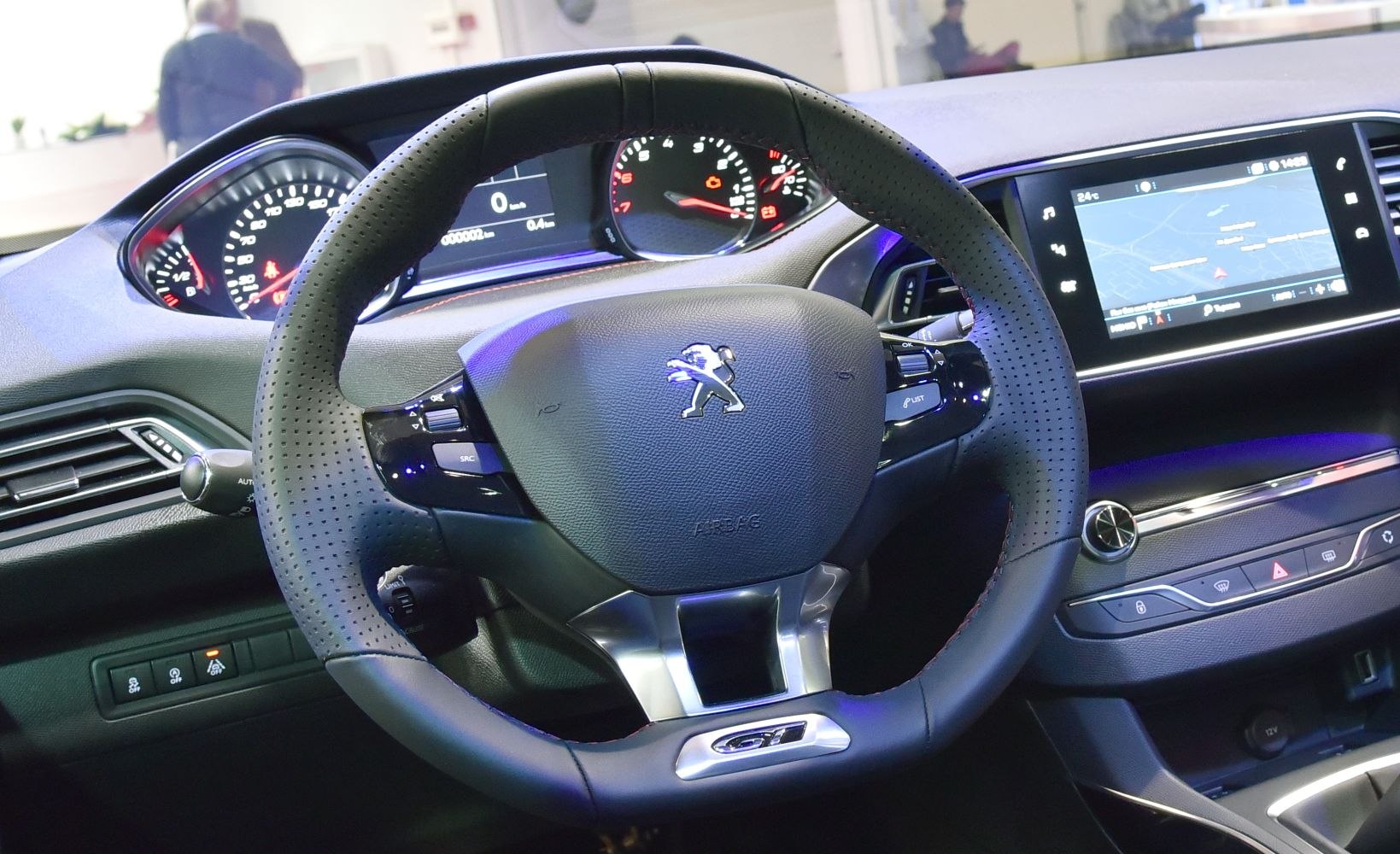 Steering wheel with GT emblem and digital dashboard with navigation touchscreen