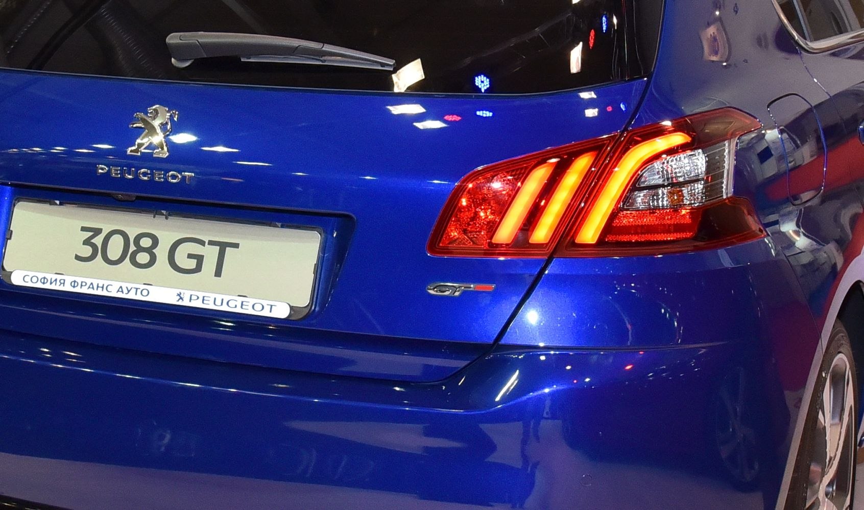 Close-up of rear GT badge and three-bar LED taillight