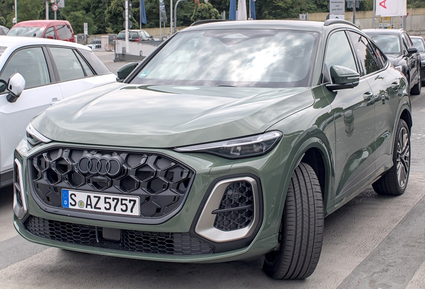 SUV front with bold hexagonal grille and slim LED headlights