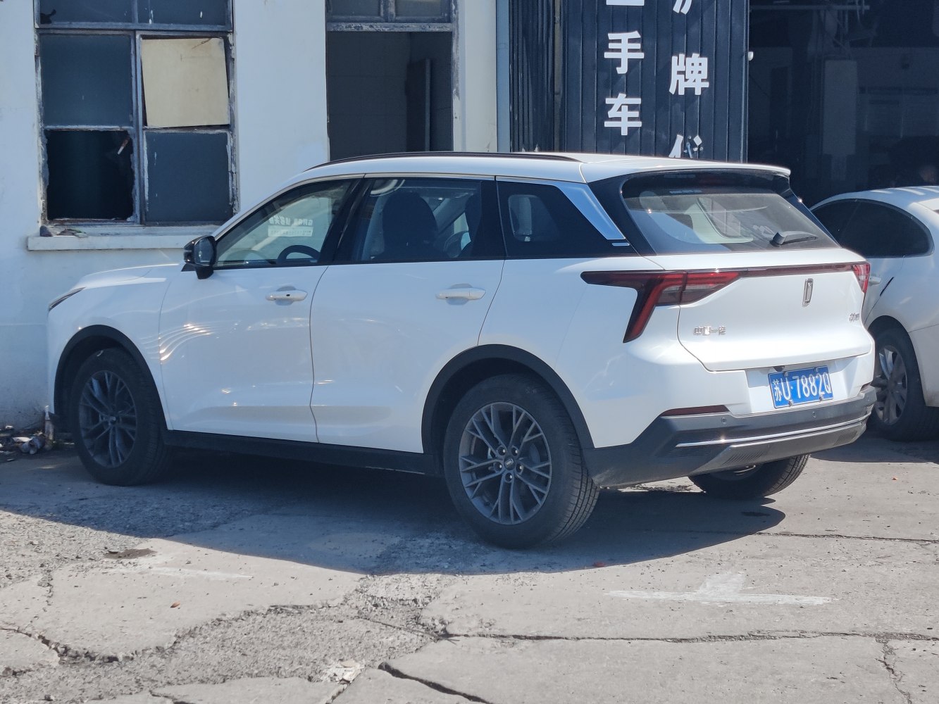 White SUV with modern taillights and alloy wheels