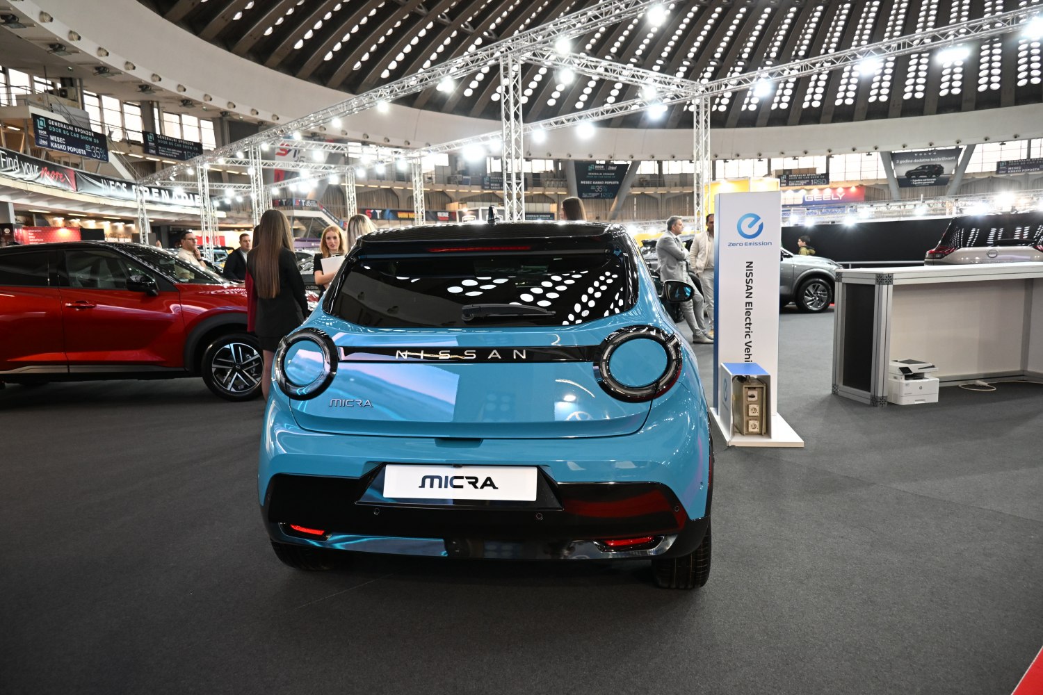 Rear hatchback with circular LED taillights and distinctive modern design.