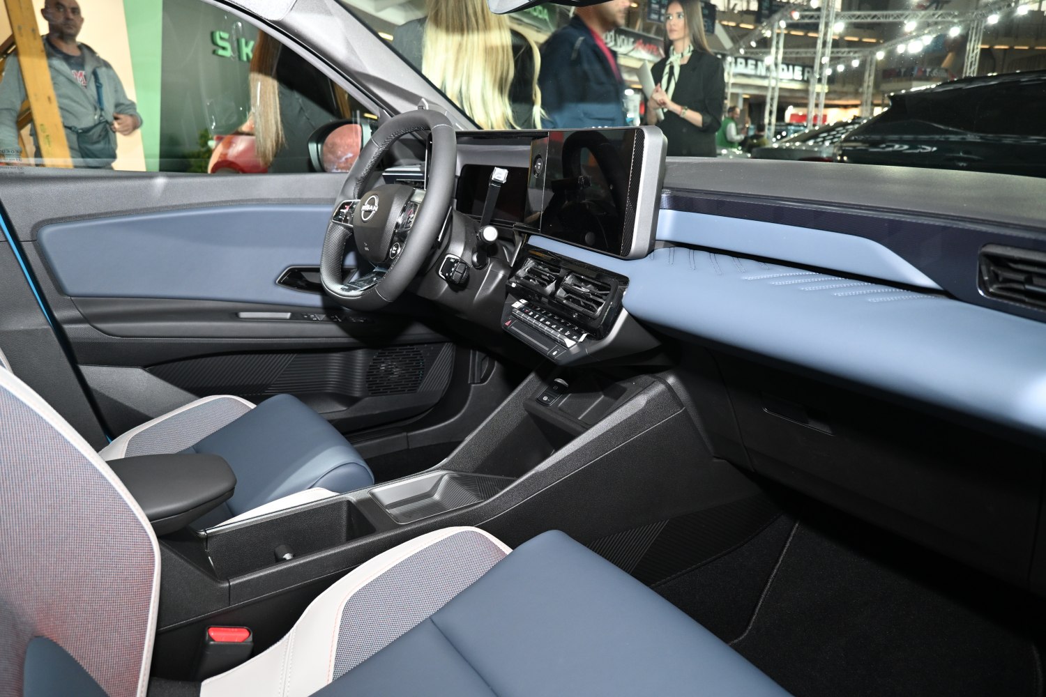 Modern digital dashboard and multifunction steering wheel inside a compact car