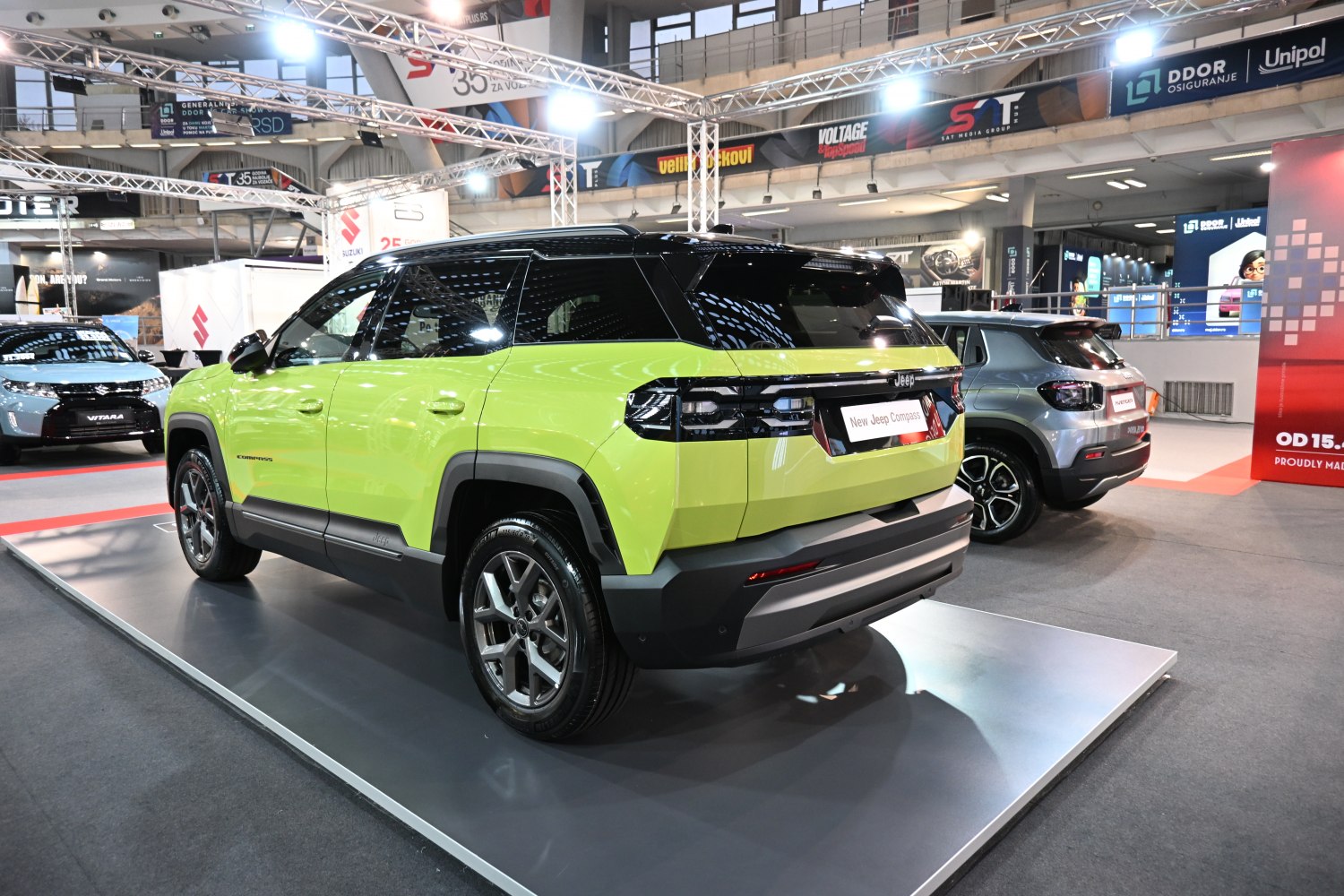 Rear-side view of a modern SUV with distinctive tail lights and two-tone body