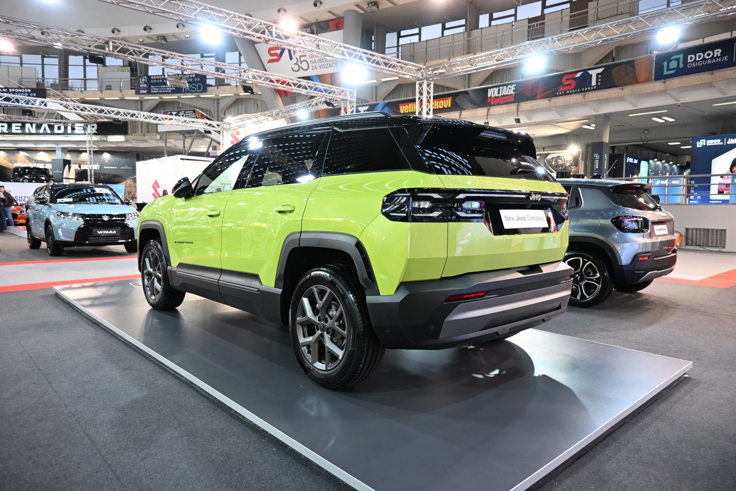 Two-tone SUV with modern tail lights displayed indoors