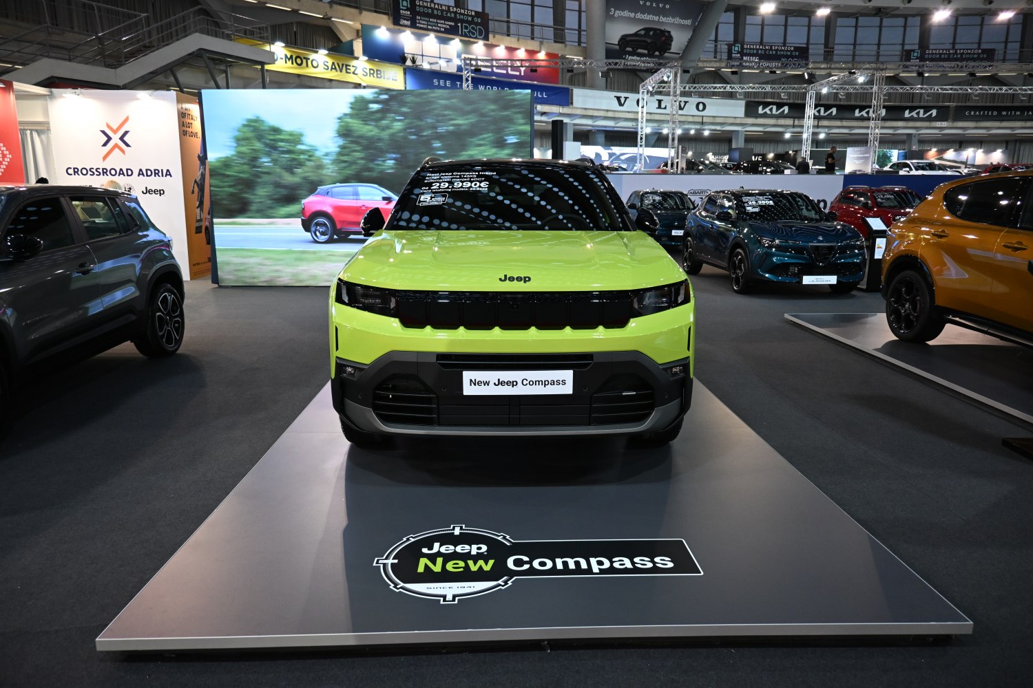 Bright green SUV front view with modern grille and headlights