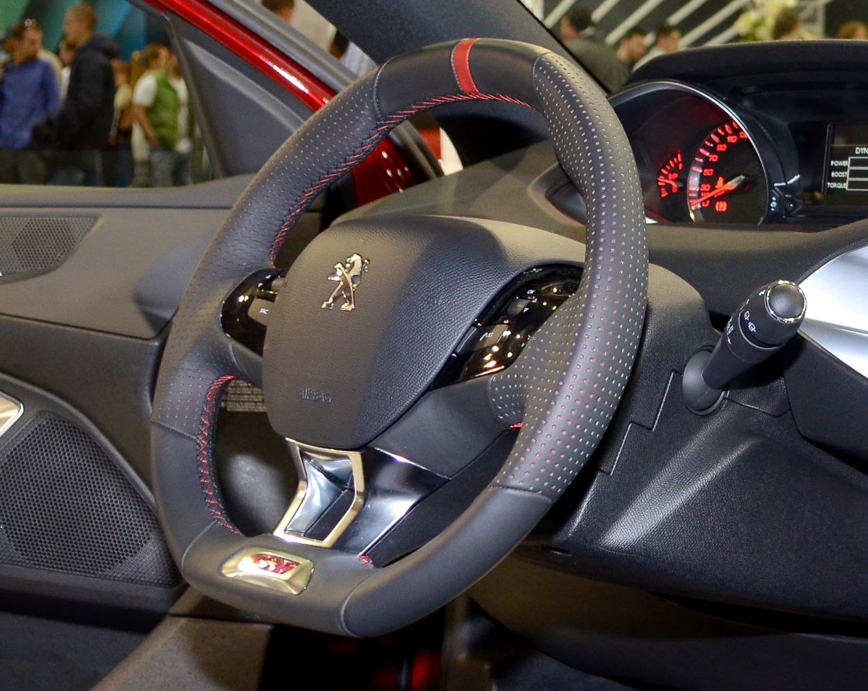 Leather steering wheel with red stitching and sporty design