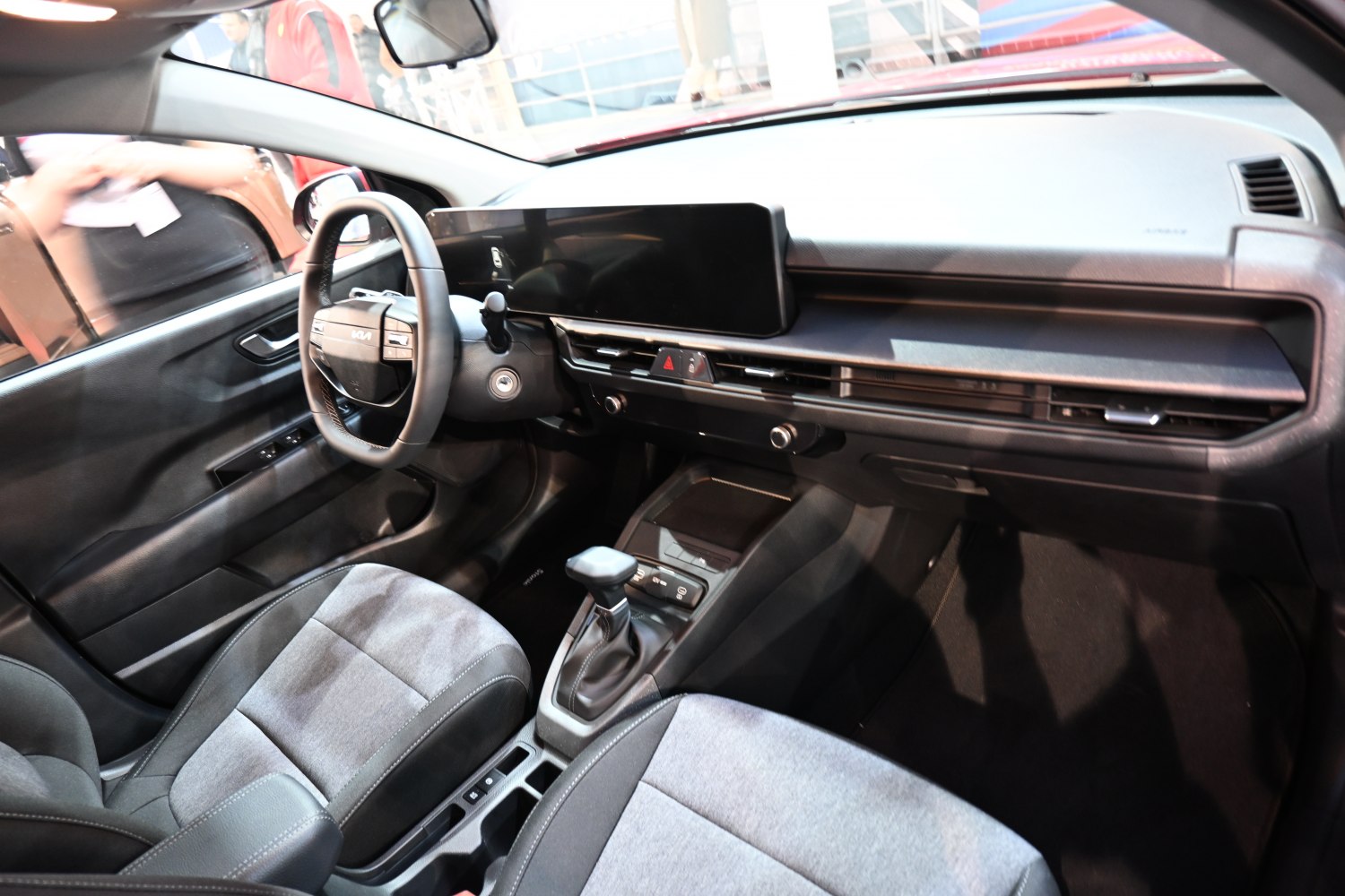 Modern car interior with wide digital display and compact automatic gearshift