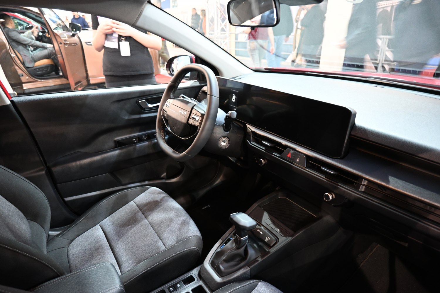 Modern steering wheel with multifunction controls and large dashboard display