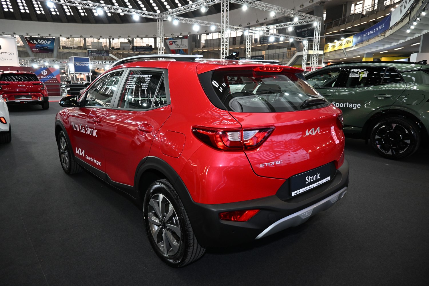 Rear and side view of red compact SUV with modern taillights and alloy wheels