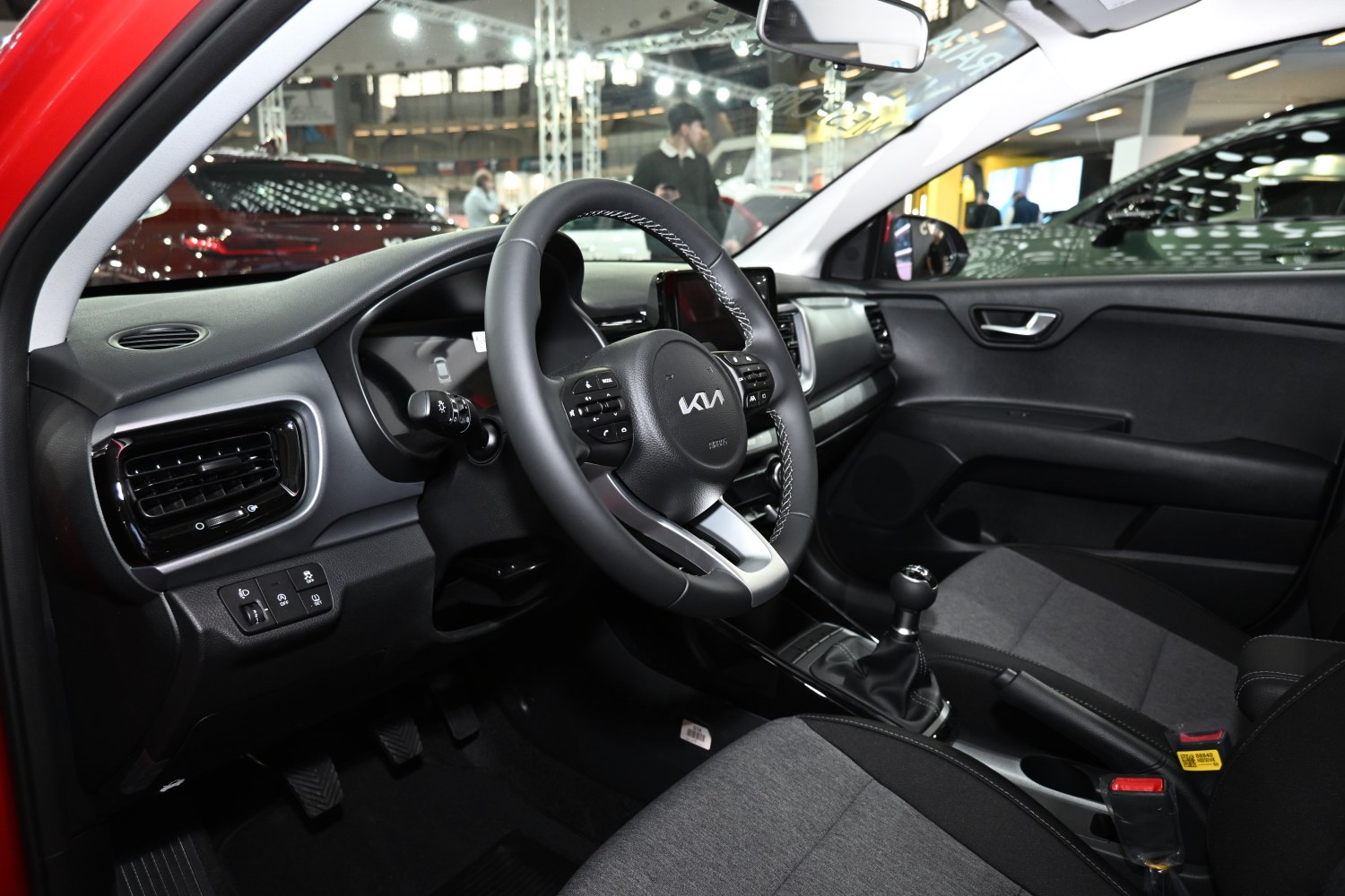 Steering wheel, manual transmission, black and gray seats interior