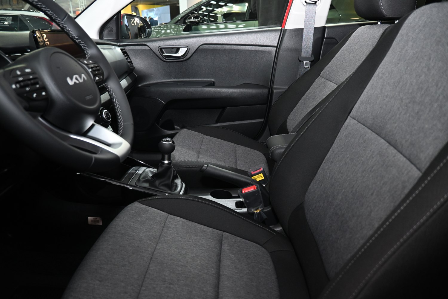 Manual gearshift, dual-tone fabric seats, modern car interior