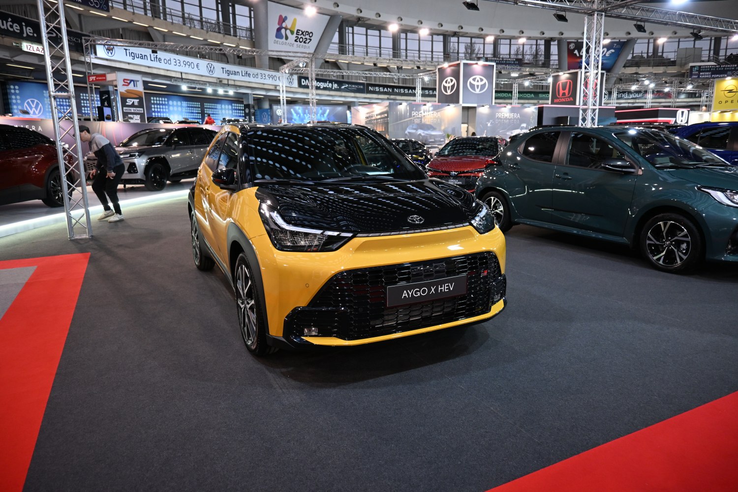 Front view of two-tone yellow and black compact hybrid SUV