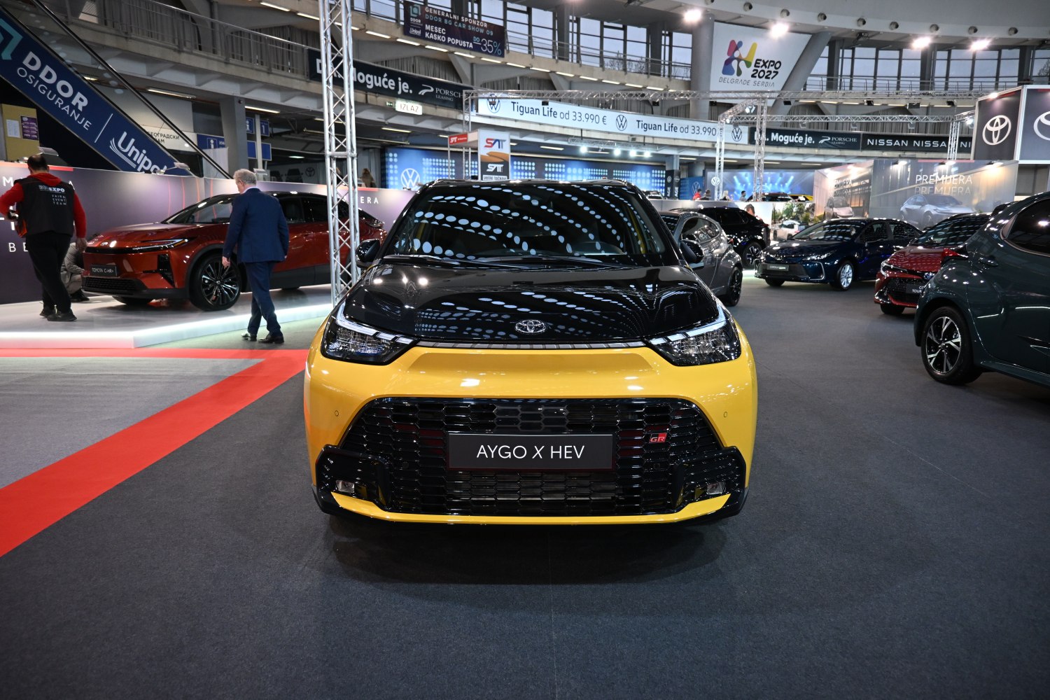 Sporty front view of a small hatchback with GR badge and yellow-black fascia