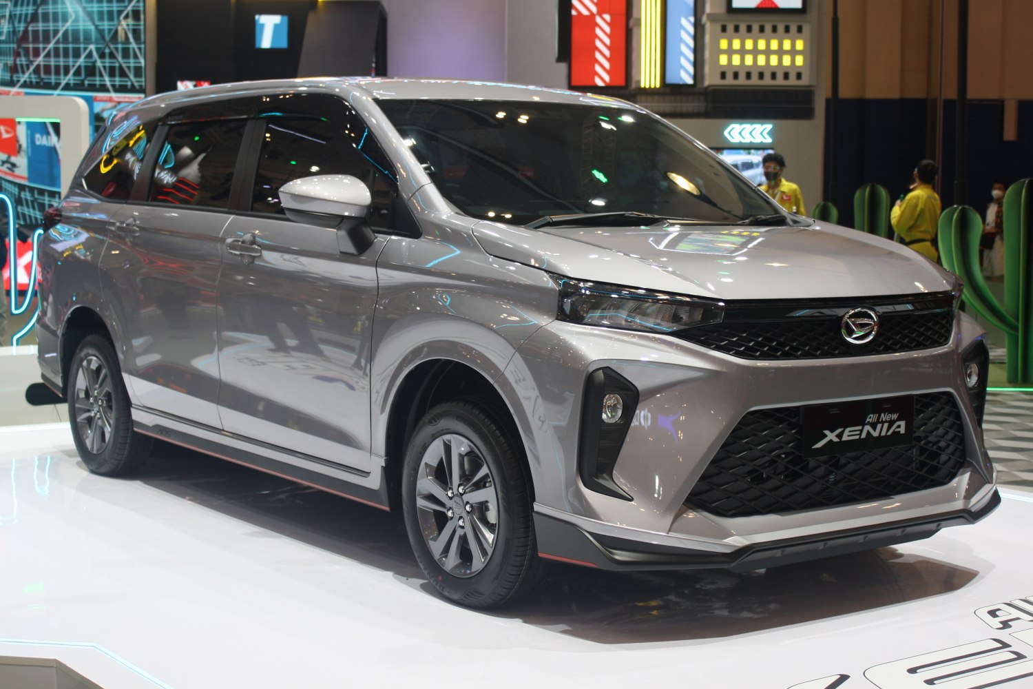 Silver multi-purpose vehicle with modern headlights and spacious side profile