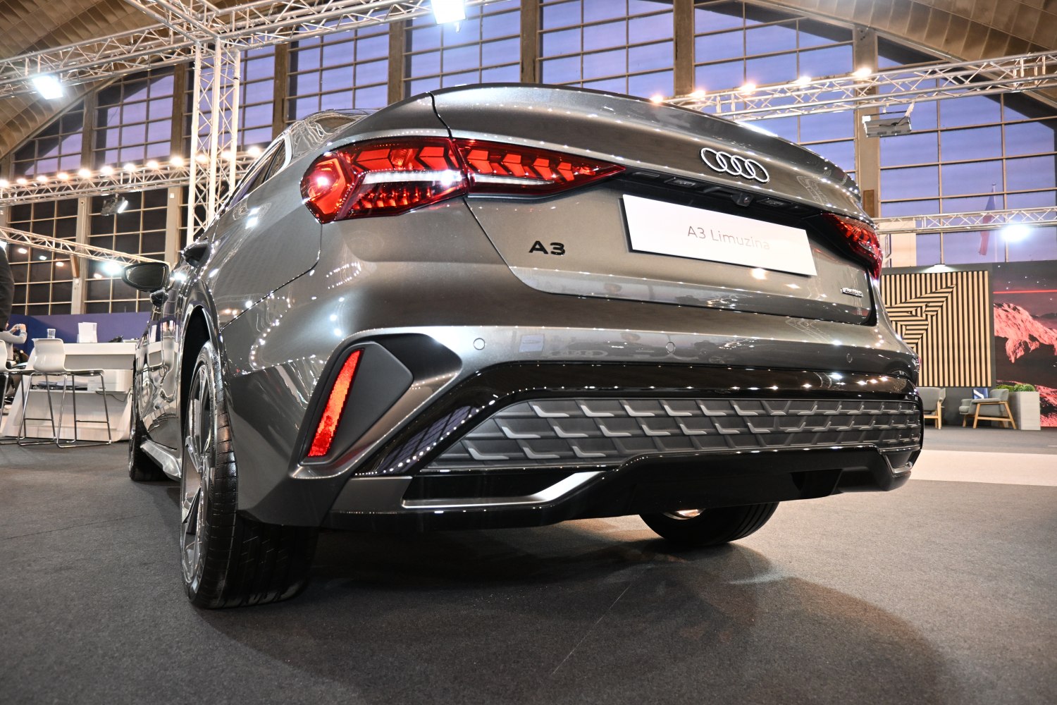 Rear view of modern sedan with distinctive taillights and bumper design