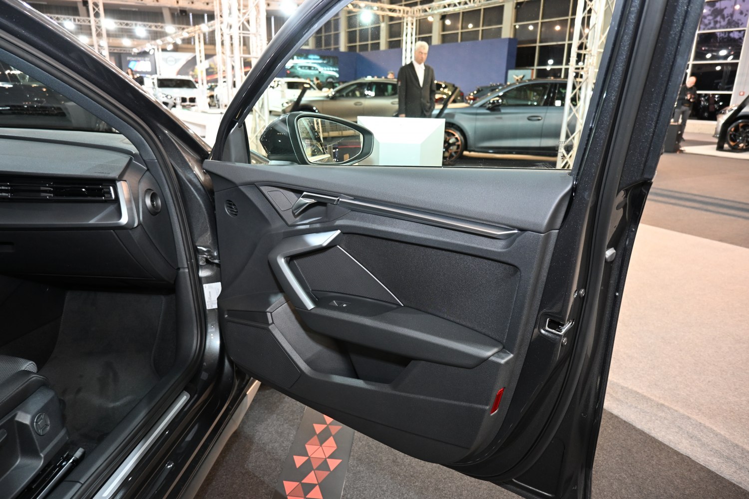 Modern interior door panel with integrated handle and speaker
