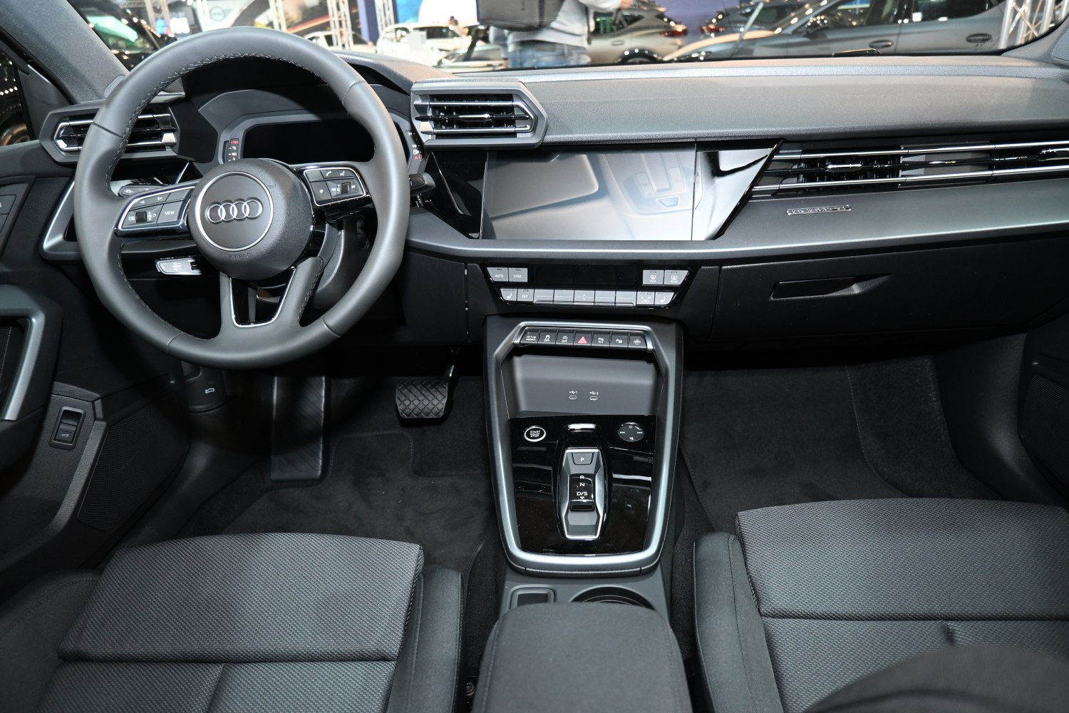 Modern interior dashboard and steering wheel with digital displays