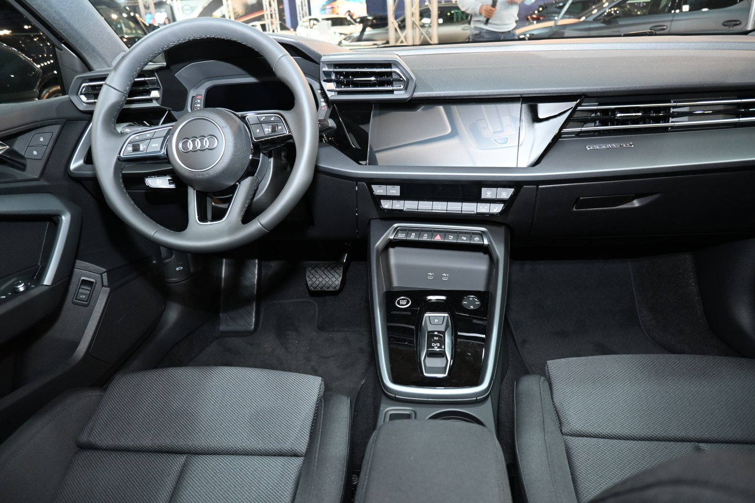 Modern car interior with digital instrument cluster and center console controls