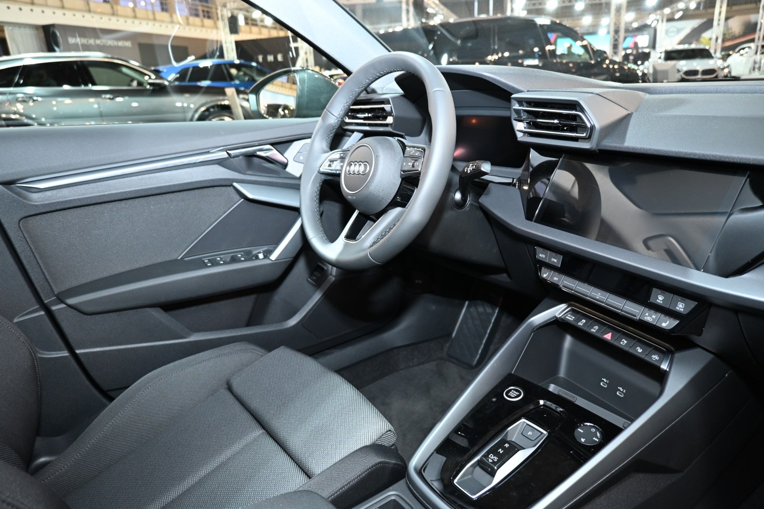 Interior view with digital dashboard and multifunction steering wheel