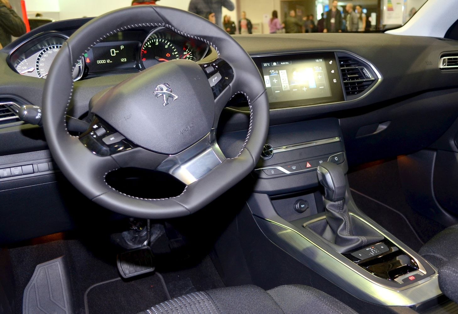 Modern car interior with digital dashboard and multifunction steering wheel
