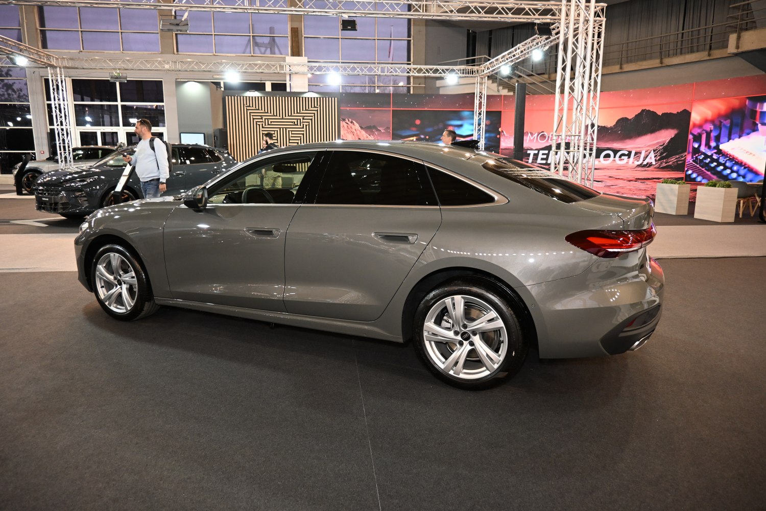 Side profile of sedan with alloy wheels and tinted windows