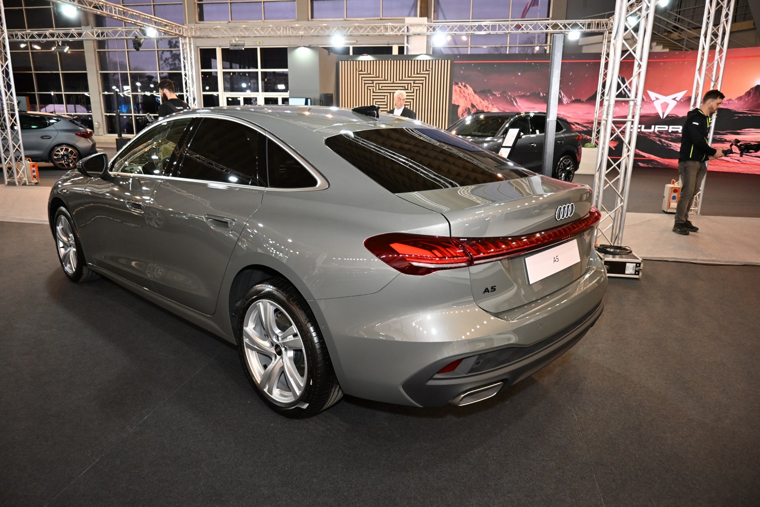 Modern sedan rear with LED tail lights and dual exhausts
