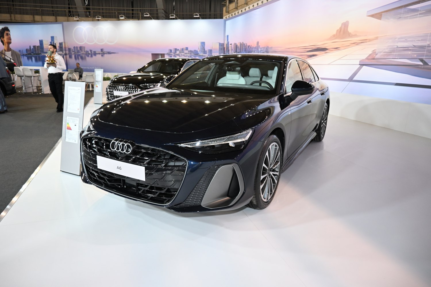 Sleek front view with LED headlights and bold grille