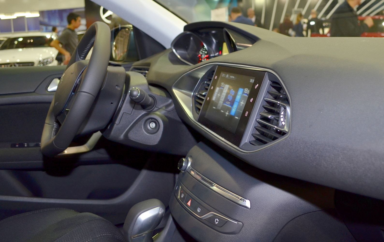 Touchscreen infotainment and driver dashboard with steering wheel