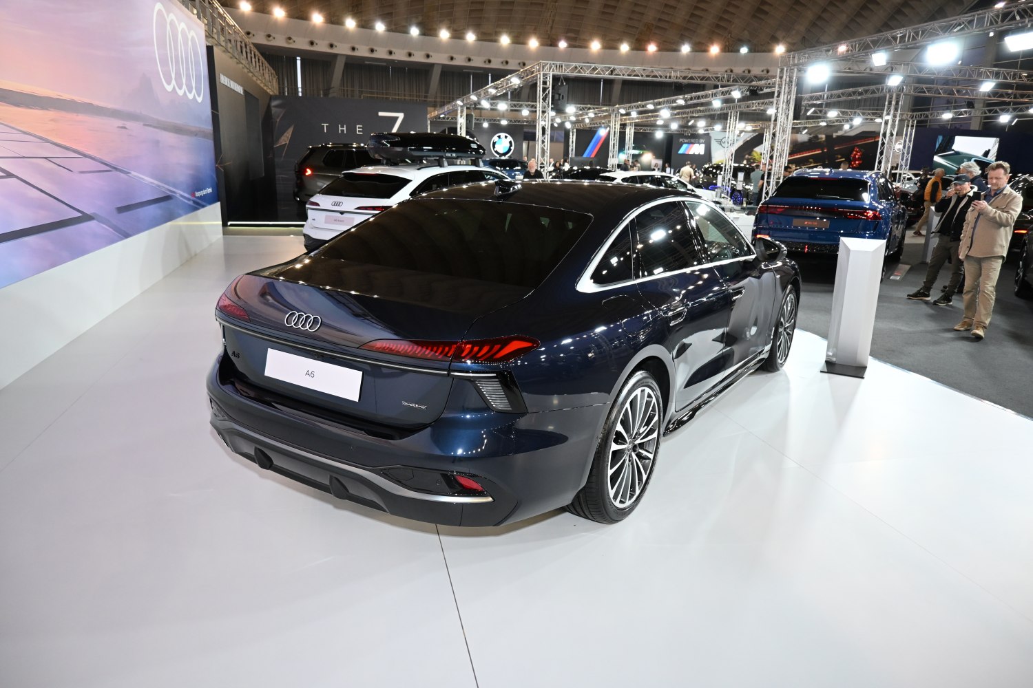 Rear and side view of a sleek modern sedan with LED tail lights