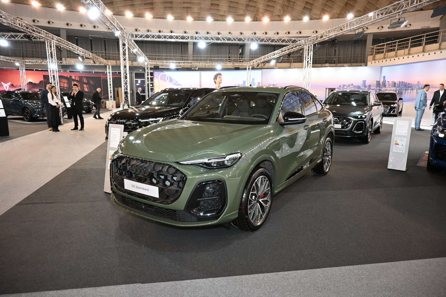 Green SUV with dark honeycomb grille and sleek LED headlights