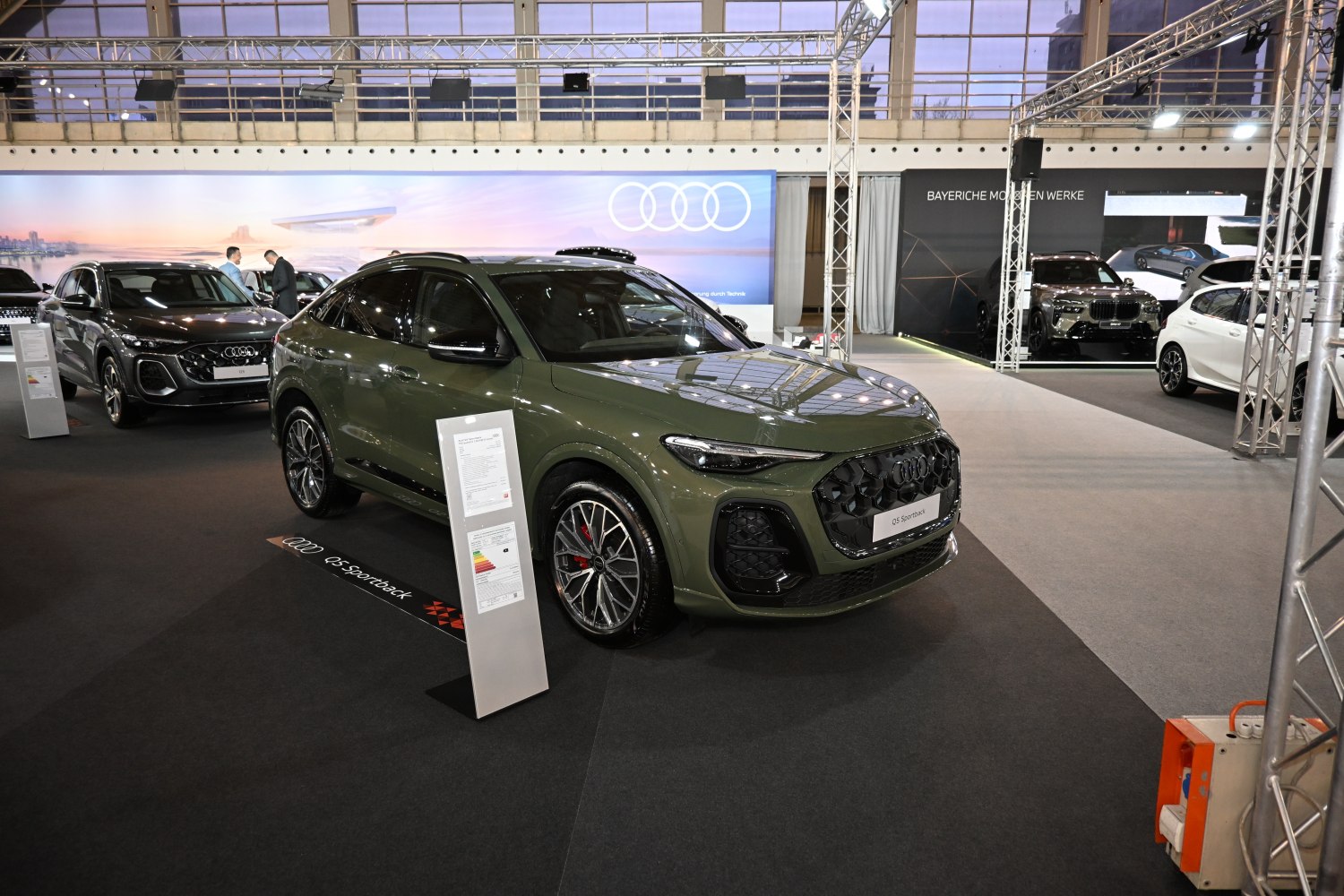 SUV with aggressive front grille and sporty alloy wheels.