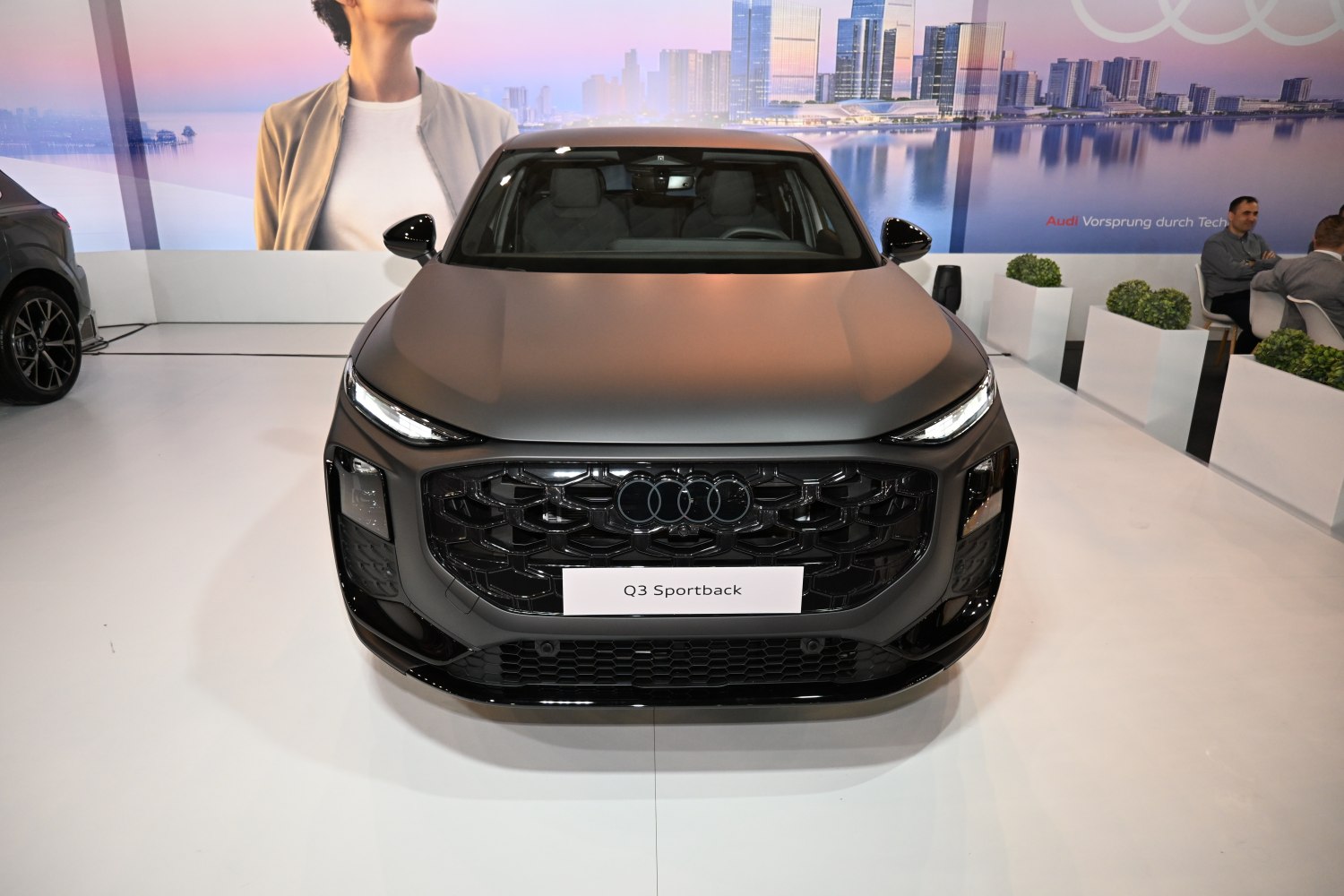 Aggressive black grille and sleek LED headlights at front view