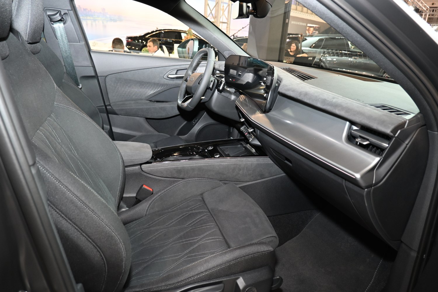 Digital dashboard, sleek center console, and sporty seats in a modern car interior