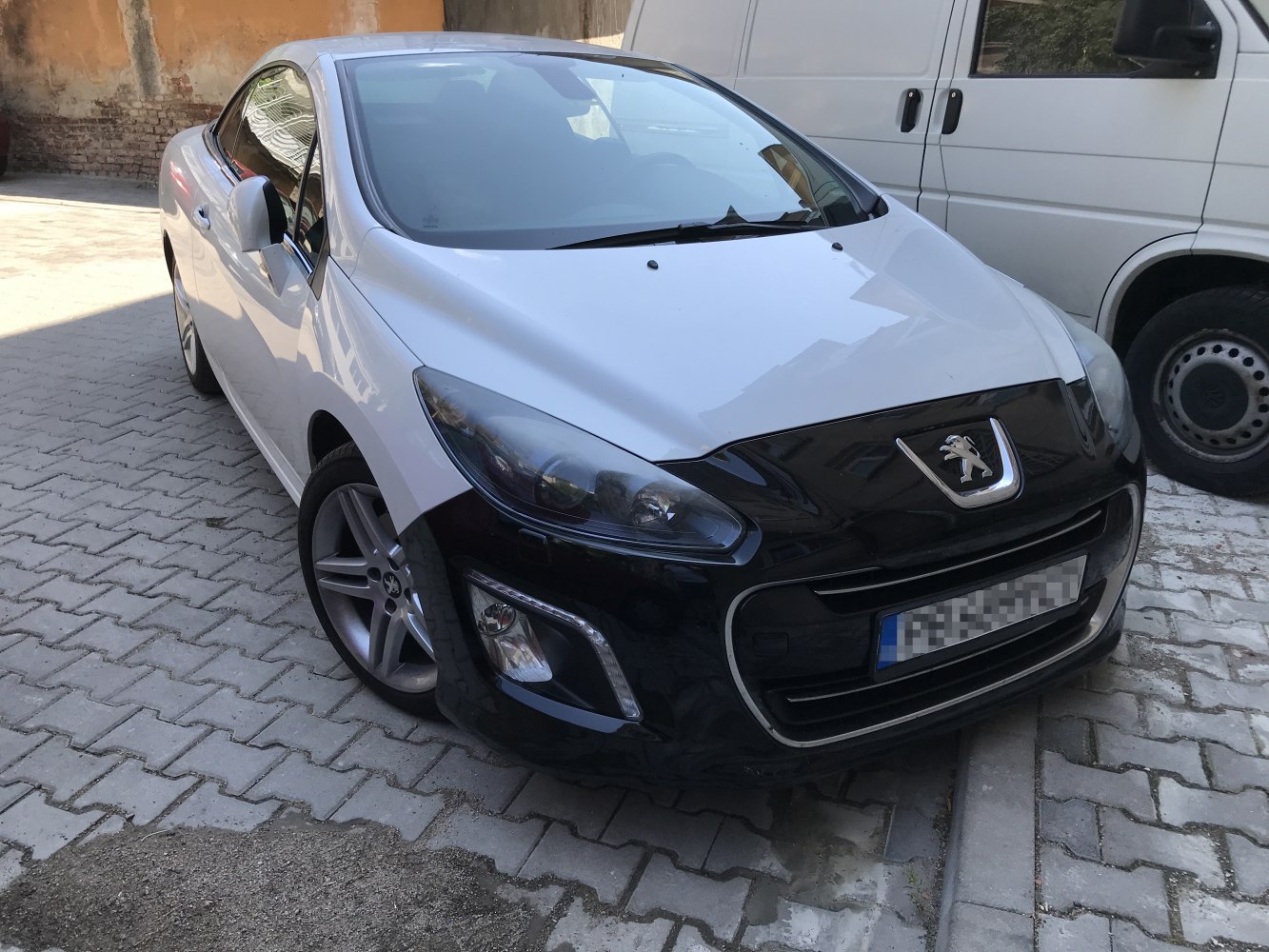 Front view with distinctive headlights and sporty alloy wheels