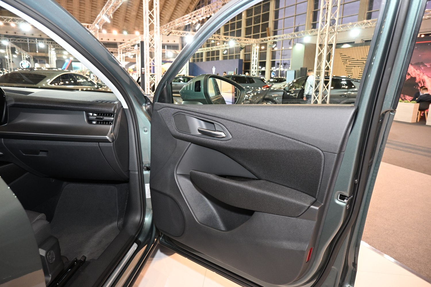Ergonomic interior door panel with armrest and speaker in modern car