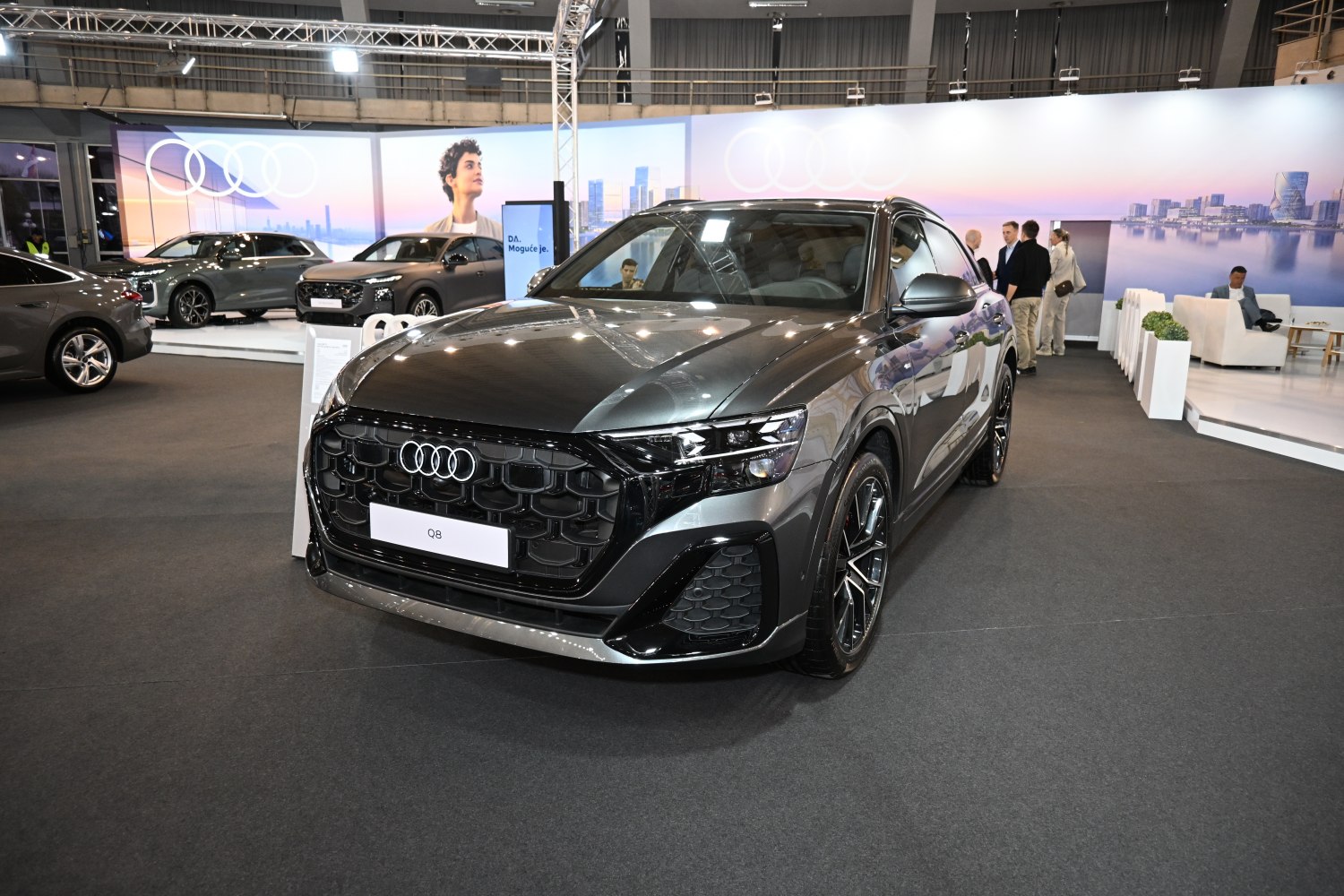 Close-up of SUV's large grille and angular LED headlights