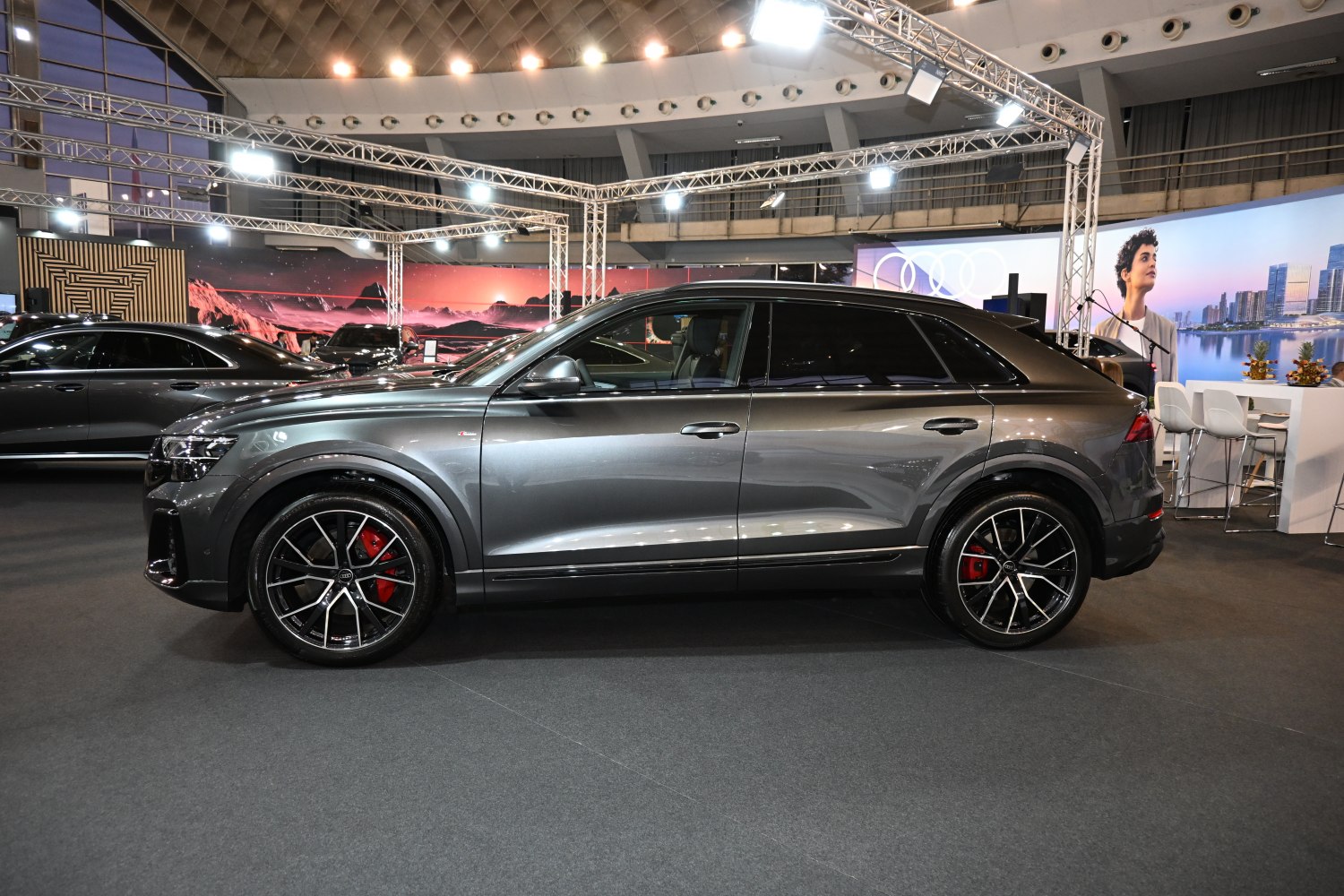 Side profile of a modern SUV with sporty alloy wheels and red brake calipers