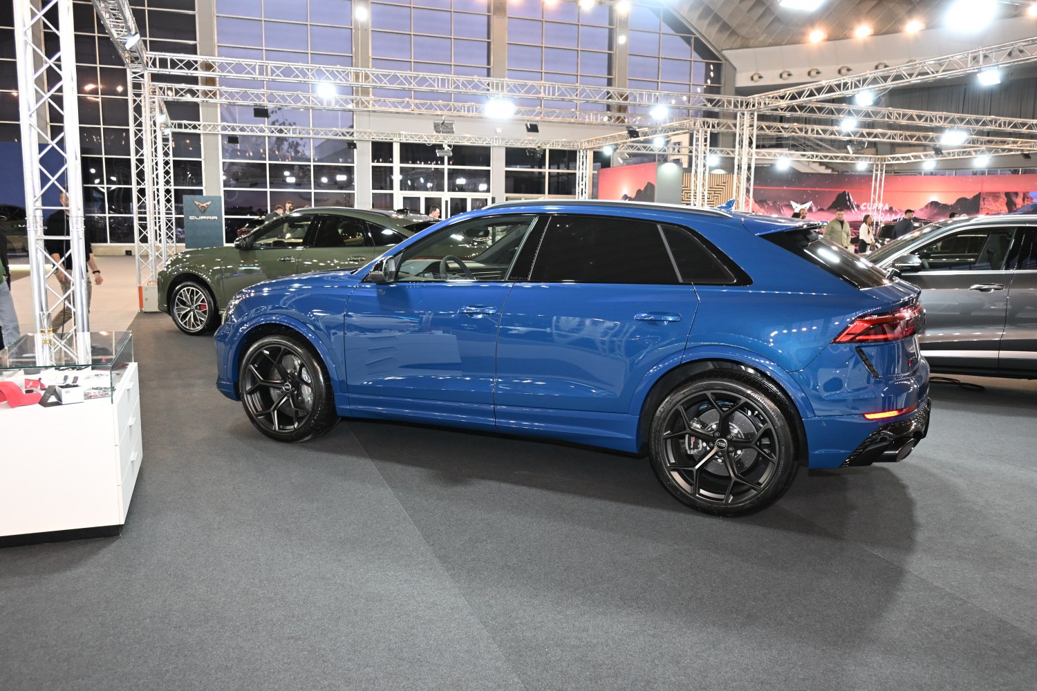 Side profile of SUV with black multi-spoke alloy wheels and tinted windows