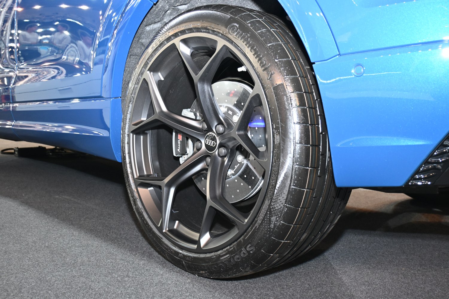 Matte black alloy wheel with Audi brake caliper and Continental tire