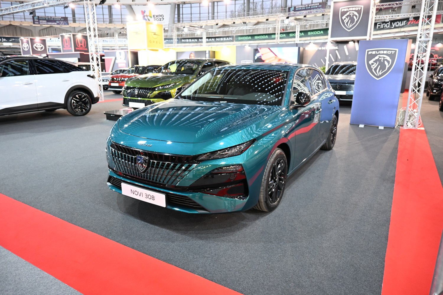 Front grille and sleek headlight design of modern hatchback