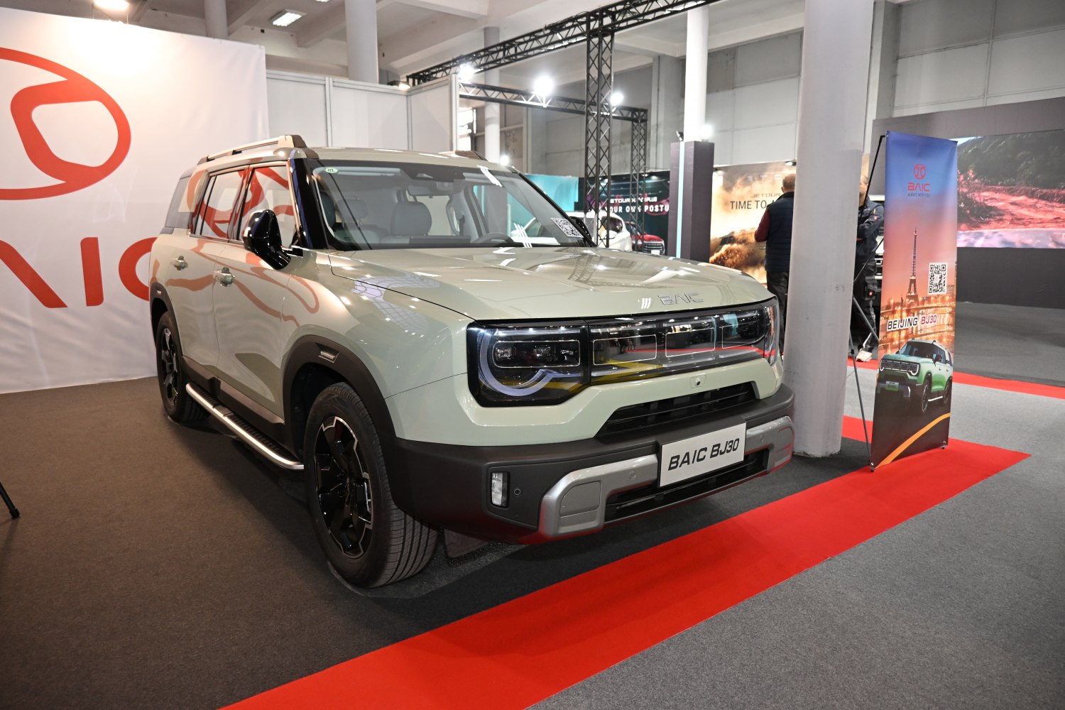 Front view of rugged SUV with modern headlights and side steps.